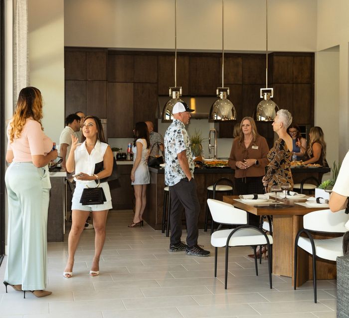Guests mingling inside the model home