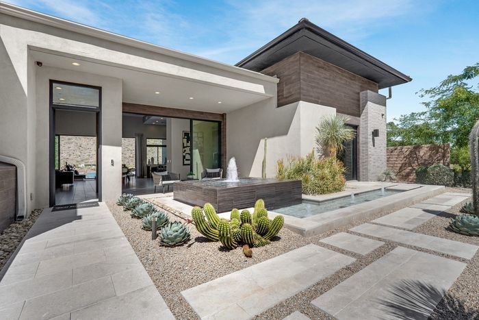 The model home entry and courtyard fountain
