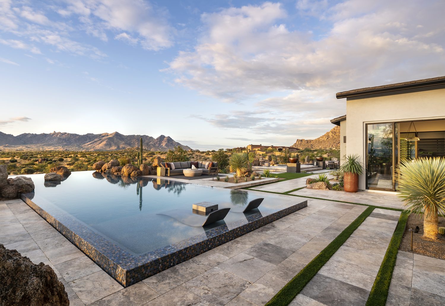 Negative-edge desert pool with mountain views